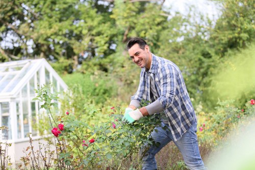 Professional gardener tending to plants